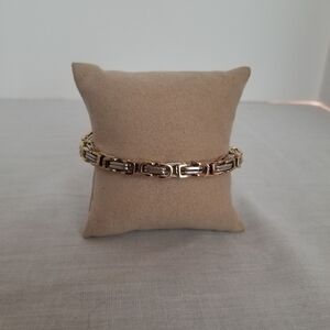 Titanium steel goldtone and silvertone bracelet. Unisex